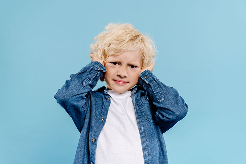 Boy-Covering-Ears
